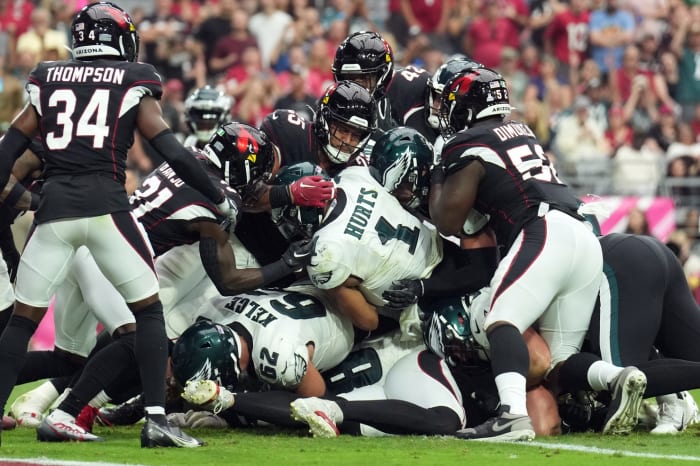 Jalen Hurts and Jason Kelce execute the contentious play known as the tush push or Brotherly Shove